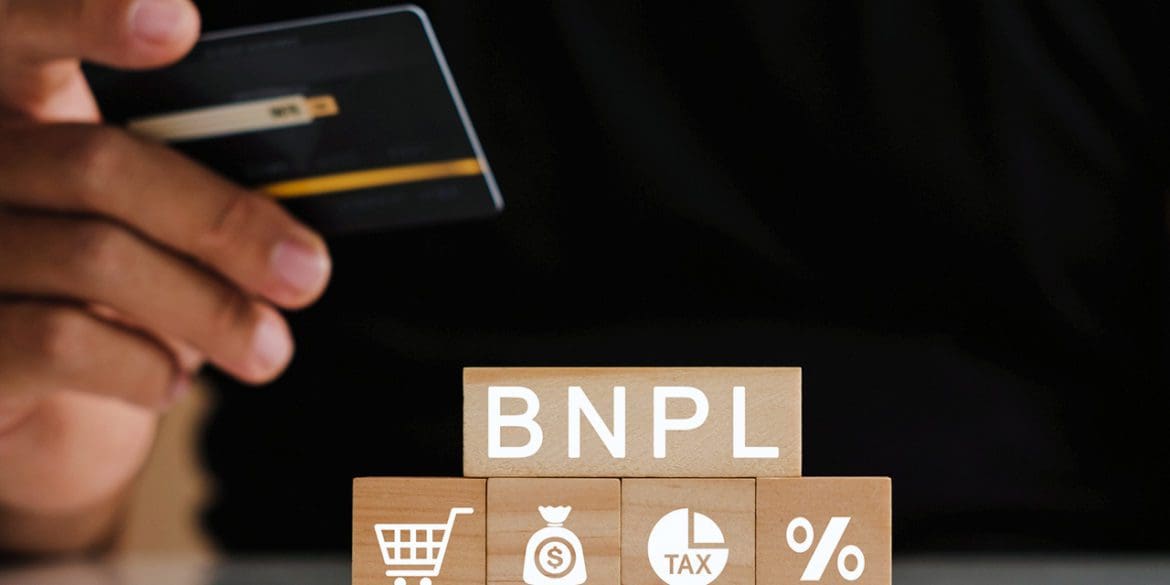 Man's hands holding credit card with BNPL icons. Buy now pay later online shopping concept. Online shopping icons.